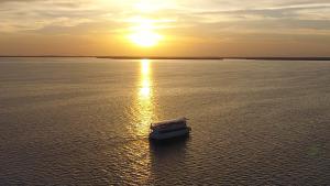 Aerial view of The Charlotte Lady (King Fisher Fleet Boat) on Charlotte Harbor for sunset cruise