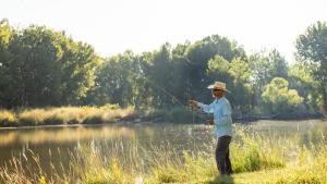 Man fly-fishing along the signature bluff trail