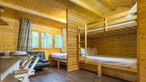 The Daisy glamping pod at Quarry Walk Park, Staffordshire, showing bunk beds, double bed, and furnishings
