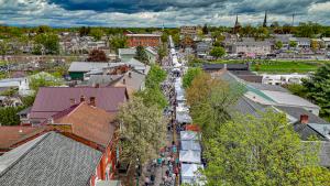Picture of Lewisburg Arts Festival from an ariel perspective looking down market street above the vendor tents.