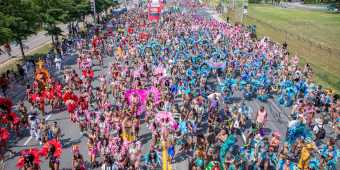 Colorful groups of dancers take part in the Grand Parade at the Toronto Caribbean Carnival