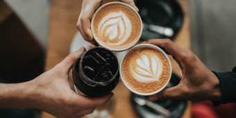Three coffee cups with latte art