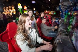 Kids Playing Arcade Game at Dave & Buster’s in Providence, RI