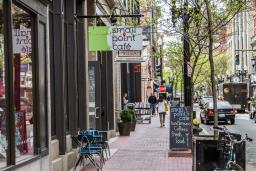 Shoppers stroll past popular boutiques on Westminster Street in Providence
