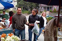 Customers Inspecting Vegetables in Goddard Park Market in Providence RI