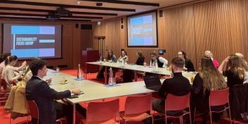 A small group of people from Meet Cambridge's venues in a meeting room at Newnham College
