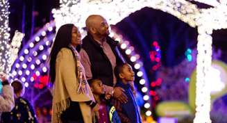 A family of four looks at the lights during Illuminations at Botanica Wichita.