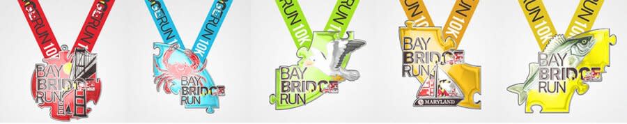 a steamed Maryland blue crab, a seagull, a sailboat, a rockfish and of course the Chesapeake Bay Bridge puzzle piece