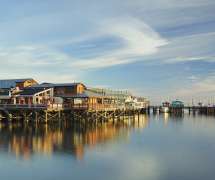 Wide shot of Old Fisherman's Wharf at Dusk Reflecting on the Monterey Bay