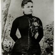 a black and white historical headshot of Belle Brezing.
