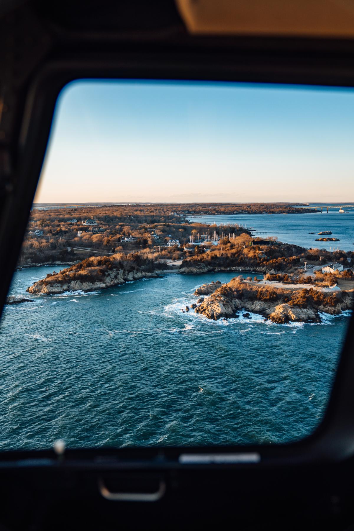 View from Newport Helicopter Tours of the island at sunset