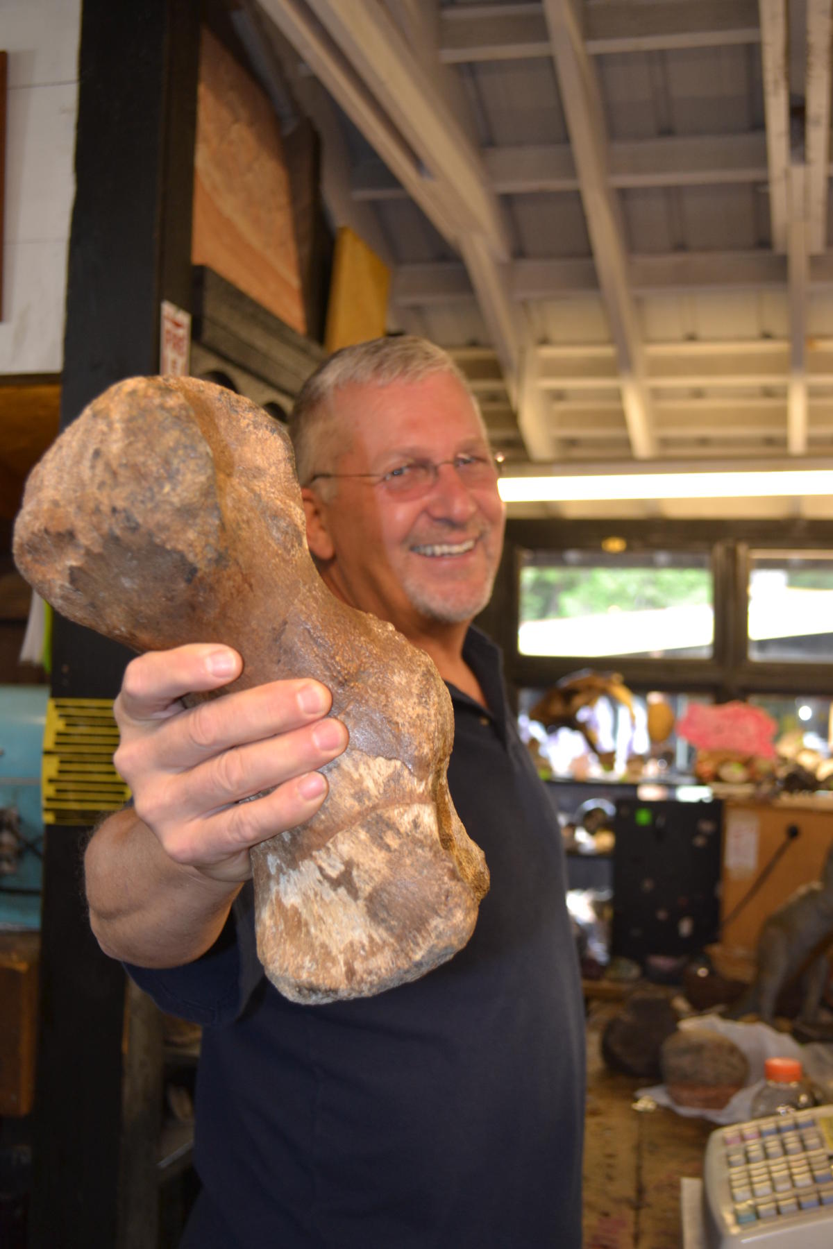 Greg Beckler holding a fossil
