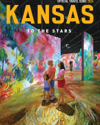 Family observes a very colorful digital art display at the Museum of Art + Light.