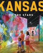 Family observes a very colorful digital art display at the Museum of Art + Light.