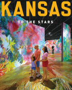 Family observes a very colorful digital art display at the Museum of Art + Light.