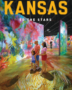 Family observes a very colorful digital art display at the Museum of Art + Light.