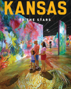 Family observes a very colorful digital art display at the Museum of Art + Light.