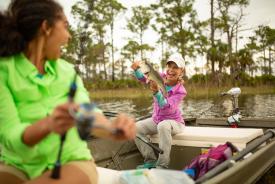 Fishing guide Debbie Hanson catches a bass at Webb Lake