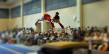 Gymnast vaulting at a competition at Charlotte Harbor Event and Conference Center in Punta Gorda/Englewood Beach