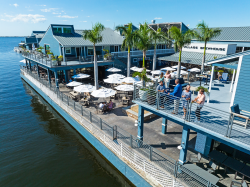 Outdoor dining on the water at Village Brewhouse at Fishermen's Village
