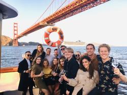 Group stands by the Golden Gate bridge on Wine Therapy