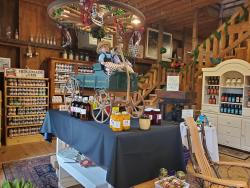Point Barn Pantry Display of Goods for sale. Cute mini Amish carriage and Amish dolls in middle of display.