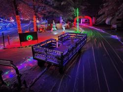 Picture of the open trailer wagon you can ride on through the Little Mexico Campground Valley of Lights display!