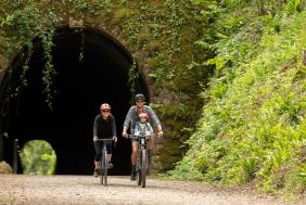 A family cycling on the Strawberry Line path in North Somerset - credit Visit West