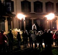 Haunted History Tour at the Seward House Museum - crowd around tour guide on steps to the museum