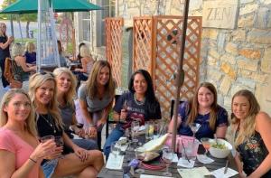 Ladies enjoying wine on the patio at Zin Zen Wine Bistro