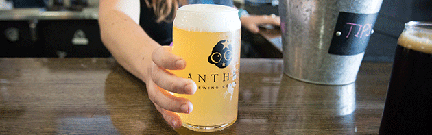 Bartender serving beer at Anthem Brewing Company In OKC