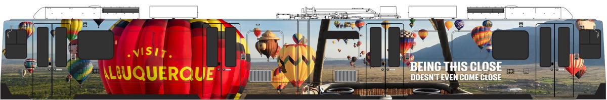 an image of a Denver light rail train wrapped in a ballooning Visit Albuquerque promotional image