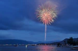 Fireworks at dusk over Lake George
