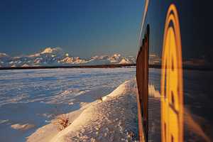 Alaska Railroad train with Denali in Winter