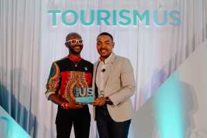 Stonewall Columbus, Inc. representative accepting the 2023 Small Business Trailblazer of the Year Award at TourismUS