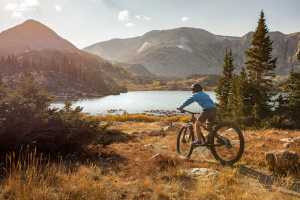 Mountain biking beneath Sugarloaf in fall.