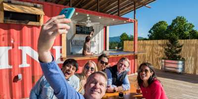 The Highland Brewing Rooftop offers beautiful views of the mountains in a cool Asheville setting