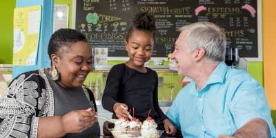 A family enjoys delicious ice cream at The Hop Ice Cream Cafe in Asheville, NC