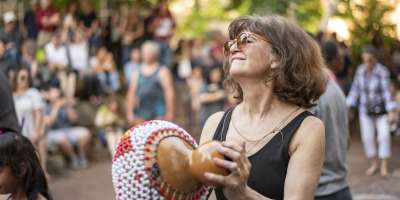 Woman dancing at drum circle in Asheville, N.C.