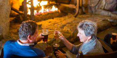 Couple by Cozy Fireplace at The Omni Grove Park Inn