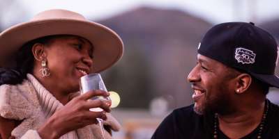 a couple drinking a glass of wine