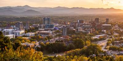The city of Asheville is set against the backdrop of the beautiful Blue Ridge Mountains