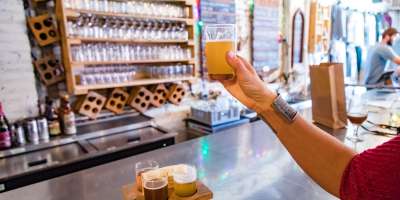 Woman holding beer glass at burial