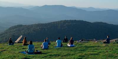 People doing mountaintop yoga on Bearwallow Mountain