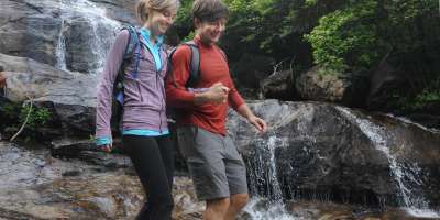 Couple hiking at waterfall