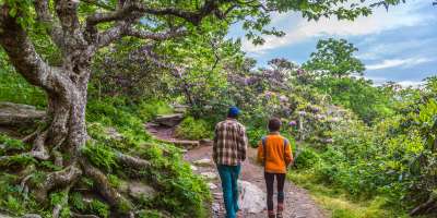 A couple hikes the Craggy Gardens Pinnacle Trail near Asheville, NC