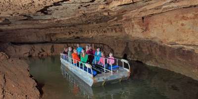 People on the underground boat ride at Indiana Caverns
