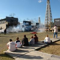 Spindletop history as actors portray a shootout at the anniversary celebration.