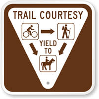 Trail Courtesy Sign. Bikers yield to hikers and horses.