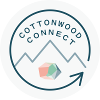 Line drawing of mountains over the Salt Lake crystal logo with a circle arrow around the words Cottonwood Connect